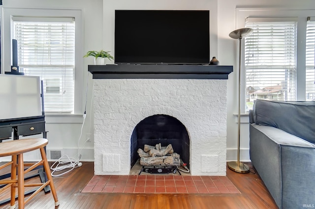 1920 Kenwood Ave, Fort Wayne, IN 46805 - detailed view of wood finished floors, baseboards, and a tile fireplace