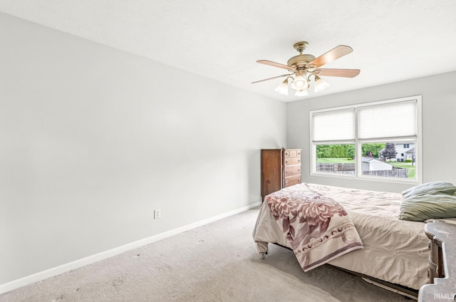 54062 Stonebridge Dr, Elkhart, IN 46514 - bedroom with baseboards, carpet, and a ceiling fan