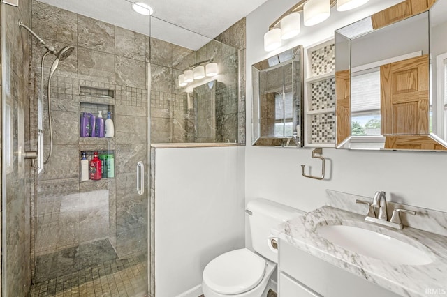 54062 Stonebridge Dr, Elkhart, IN 46514 - bathroom with a stall shower, vanity, and toilet