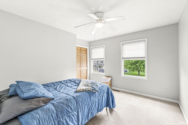 54062 Stonebridge Dr, Elkhart, IN 46514 - bedroom with baseboards, carpet flooring, ceiling fan, and a closet