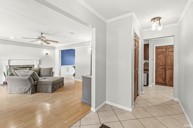 54062 Stonebridge Dr, Elkhart, IN 46514 - hallway featuring crown molding, baseboards, and light wood-style flooring