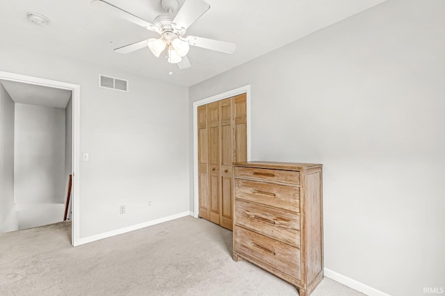 54062 Stonebridge Dr, Elkhart, IN 46514 - unfurnished bedroom with light carpet, baseboards, a closet, and a ceiling fan