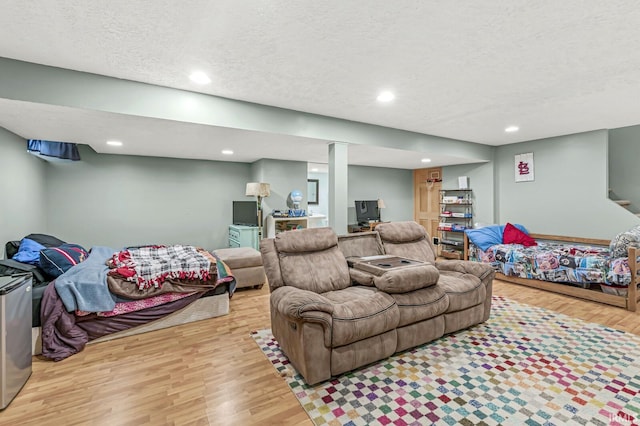 54062 Stonebridge Dr, Elkhart, IN 46514 - living area featuring wood finished floors, a textured ceiling, and recessed lighting