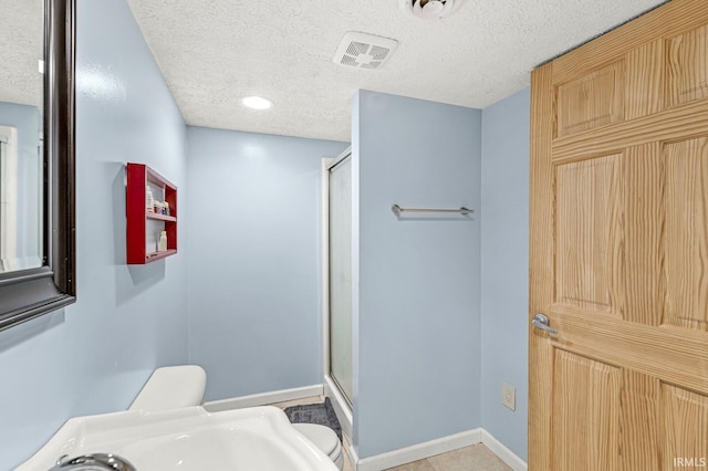 54062 Stonebridge Dr, Elkhart, IN 46514 - full bath featuring a shower stall, a textured ceiling, baseboards, and toilet