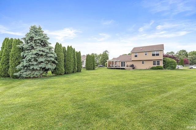 54062 Stonebridge Dr, Elkhart, IN 46514 - view of grassy yard with a wooden deck