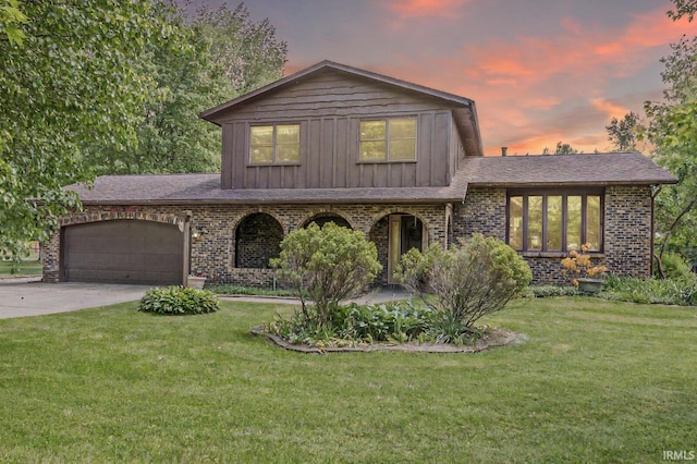 14104 Day Rd, Mishawaka, IN 46545 - split level home featuring brick siding, a yard, a garage, and driveway