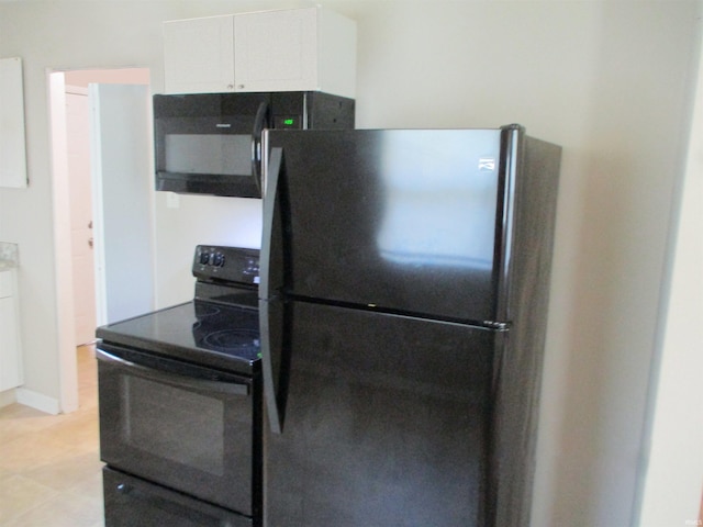1103 S Jersey Ave, Muncie, IN 47302 - kitchen with black appliances and white cabinetry