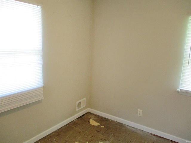 1103 S Jersey Ave, Muncie, IN 47302 - empty room featuring baseboards and healthy amount of natural light