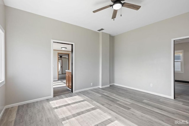 721 E Markland Ave, Kokomo, IN 46902 - spare room featuring a ceiling fan, light wood-style flooring, and baseboards