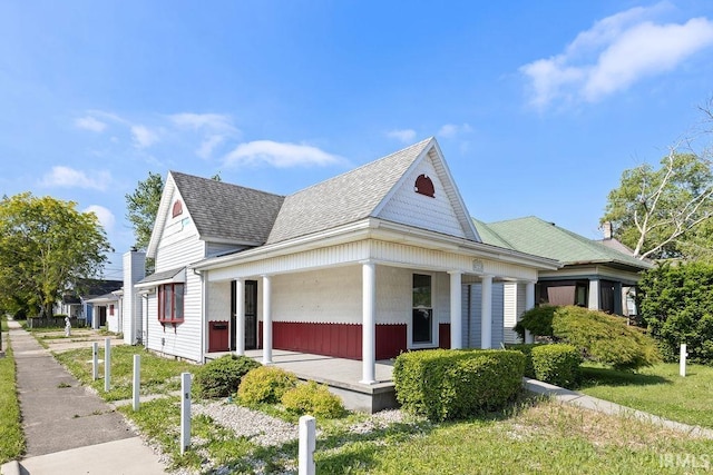 721 E Markland Ave, Kokomo, IN 46902 - view of side of property featuring a porch and roof with shingles