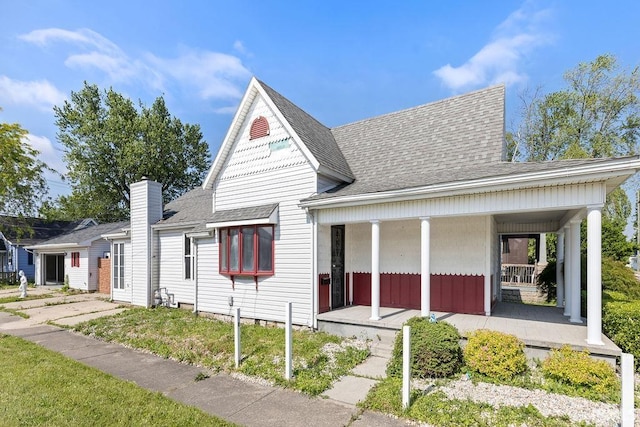 721 E Markland Ave, Kokomo, IN 46902 - view of front of house with a porch and roof with shingles