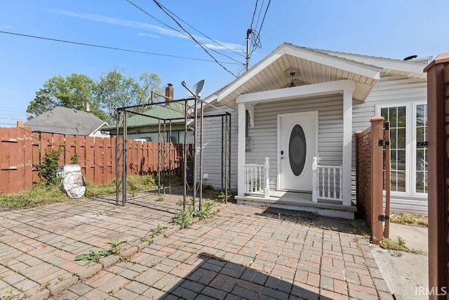 721 E Markland Ave, Kokomo, IN 46902 - view of exterior entry featuring a patio and a chimney