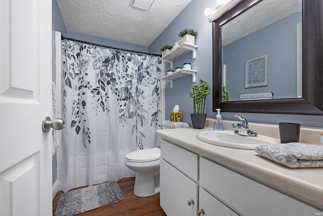 6008 Hinsdale Ln, Fort Wayne, IN 46835 - bathroom with an ornate ceiling, wood finished floors, vanity, toilet, and a shower with shower curtain