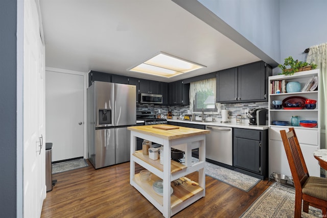 6008 Hinsdale Ln, Fort Wayne, IN 46835 - kitchen featuring stainless steel appliances, open shelves, wood counters, and decorative backsplash
