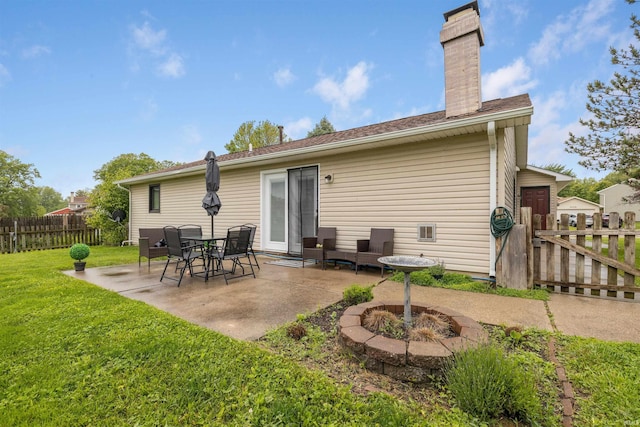 6008 Hinsdale Ln, Fort Wayne, IN 46835 - rear view of property featuring a patio, a chimney, and an outdoor fire pit