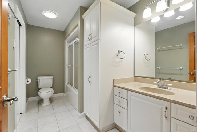 2882 E Hickory Ln, Columbia City, IN 46725 - full bathroom featuring toilet, vanity, tile patterned flooring, bath / shower combo with glass door, and baseboards