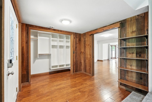 2882 E Hickory Ln, Columbia City, IN 46725 - hall with baseboards, wood finished floors, and wooden walls