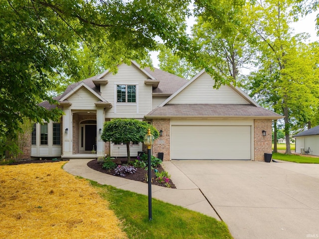8505 Crenshaw Ct, Fort Wayne, IN 46835 - view of front of property featuring brick siding, concrete driveway, an attached garage, and a shingled roof