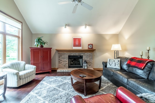 8505 Crenshaw Ct, Fort Wayne, IN 46835 - living room with vaulted ceiling, dark wood-style flooring, a ceiling fan, a fireplace, and baseboards