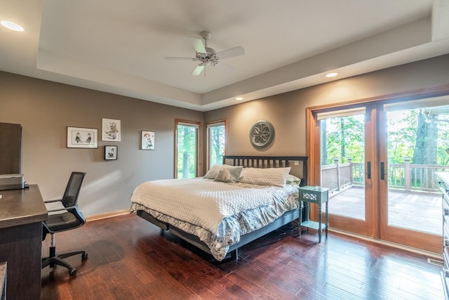 8505 Crenshaw Ct, Fort Wayne, IN 46835 - bedroom featuring access to exterior, multiple windows, a raised ceiling, wood finished floors, and recessed lighting