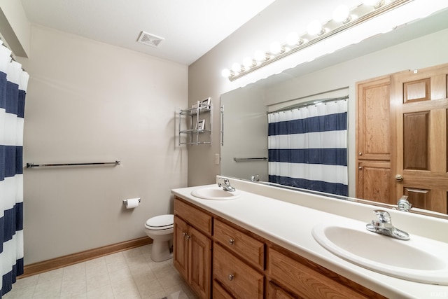 8505 Crenshaw Ct, Fort Wayne, IN 46835 - full bathroom with double vanity, baseboards, and toilet