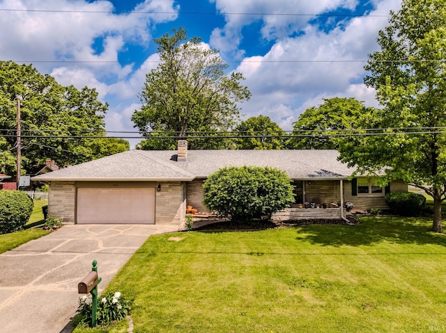 3400 W Petty Rd, Muncie, IN 47304 - ranch-style home featuring a front yard, a shingled roof, concrete driveway, and brick siding