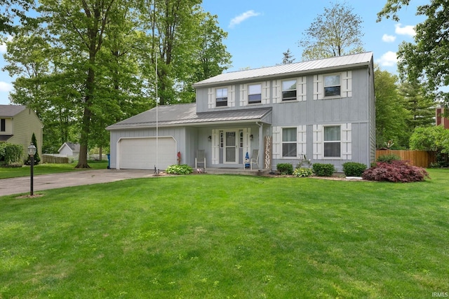 9006 Forestdale Dr, New Haven, IN 46774 - view of front of property featuring board and batten siding, metal roof, driveway, a garage, and a standing seam roof