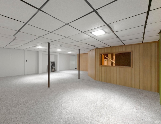 9006 Forestdale Dr, New Haven, IN 46774 - finished below grade area with carpet floors, wooden walls, and a drop ceiling
