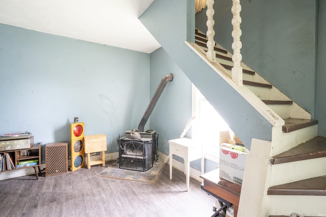 430 S Columbia St, Warsaw, IN 46580 - stairway with a wood stove and wood finished floors