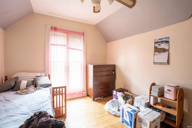 430 S Columbia St, Warsaw, IN 46580 - bedroom with wood-type flooring, vaulted ceiling, and a ceiling fan