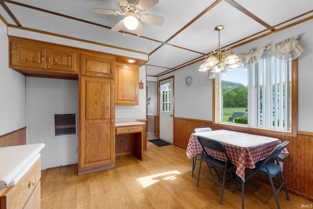 5460 N 550 E, Churubusco, IN 46723 - dining area featuring wainscoting, wood walls, light wood finished floors, a chandelier, and a ceiling fan