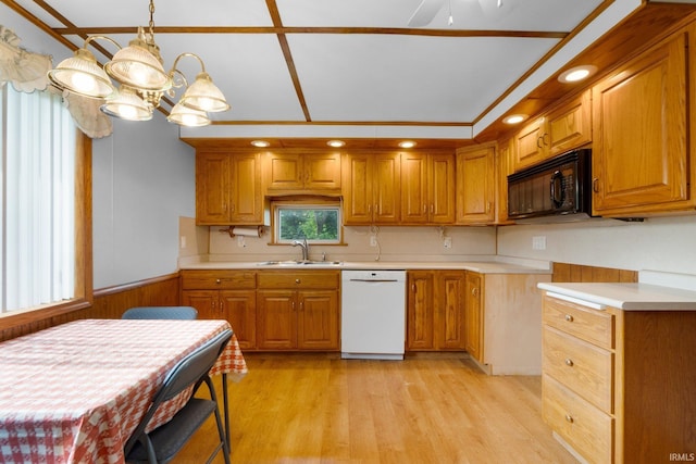 5460 N 550 E, Churubusco, IN 46723 - kitchen featuring white dishwasher, a sink, black microwave, light countertops, and brown cabinets