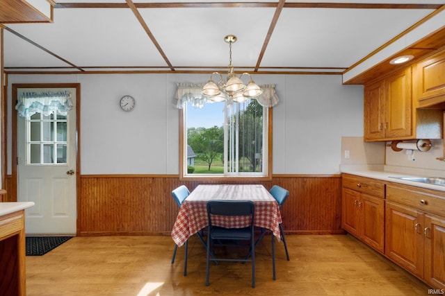 5460 N 550 E, Churubusco, IN 46723 - dining room with a chandelier, a wainscoted wall, light wood-type flooring, wood walls, and ornamental molding