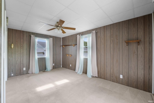 5460 N 550 E, Churubusco, IN 46723 - unfurnished bedroom featuring carpet flooring, a drop ceiling, wood walls, and ceiling fan