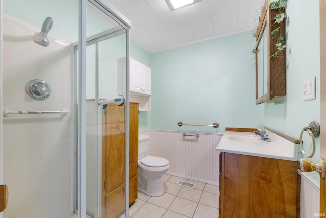 5460 N 550 E, Churubusco, IN 46723 - full bath with vanity, a stall shower, toilet, a wainscoted wall, and tile patterned floors