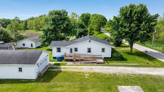 5460 N 550 E, Churubusco, IN 46723 - rear view of property featuring a deck, a lawn, and view of wooded area