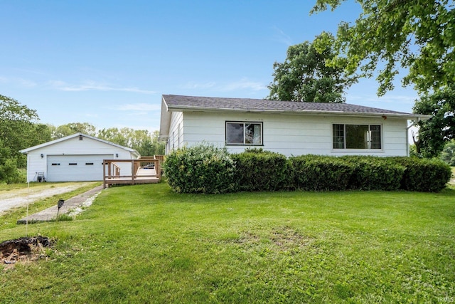 5460 N 550 E, Churubusco, IN 46723 - view of front of home featuring a detached garage, a front lawn, an outbuilding, and a deck