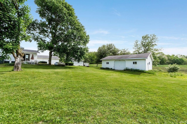 5460 N 550 E, Churubusco, IN 46723 - view of green lawn featuring an outbuilding and a detached garage