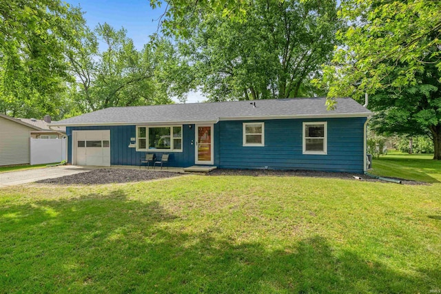 303 W 6th St, North Manchester, IN 46962 - ranch-style house featuring an attached garage, driveway, board and batten siding, and a front yard