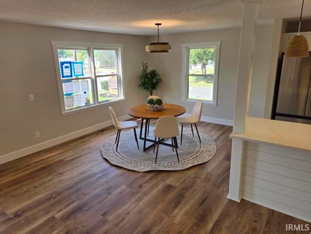 5317 Stellhorn Rd, Fort Wayne, IN 46815 - dining room featuring baseboards, dark wood-style floors, and a textured ceiling