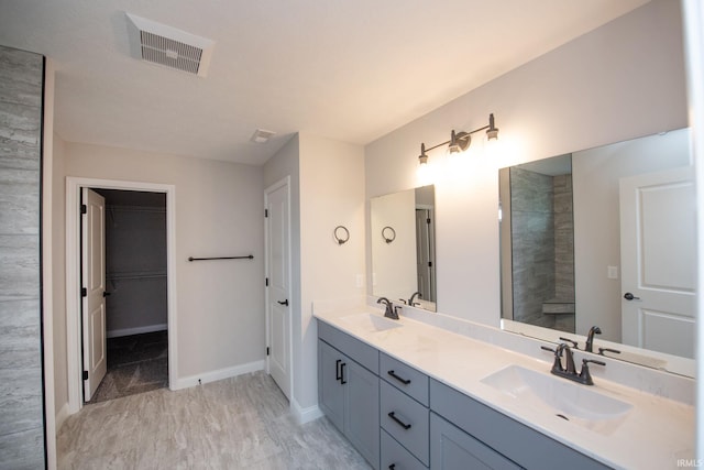 909 S Hoke Ave, Frankfort, IN 46041 - bathroom featuring double vanity and a spacious closet