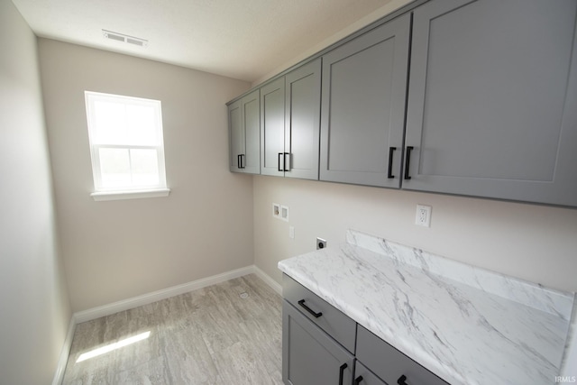 909 S Hoke Ave, Frankfort, IN 46041 - washroom with hookup for an electric dryer, cabinet space, washer hookup, and baseboards