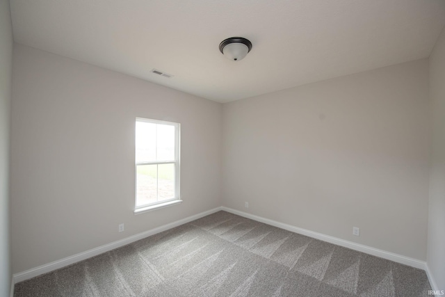 909 S Hoke Ave, Frankfort, IN 46041 - carpeted empty room with baseboards