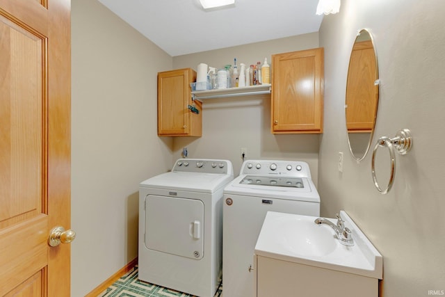 2104 Shady Ln, Garrett, IN 46738 - laundry area with washer and clothes dryer and cabinet space