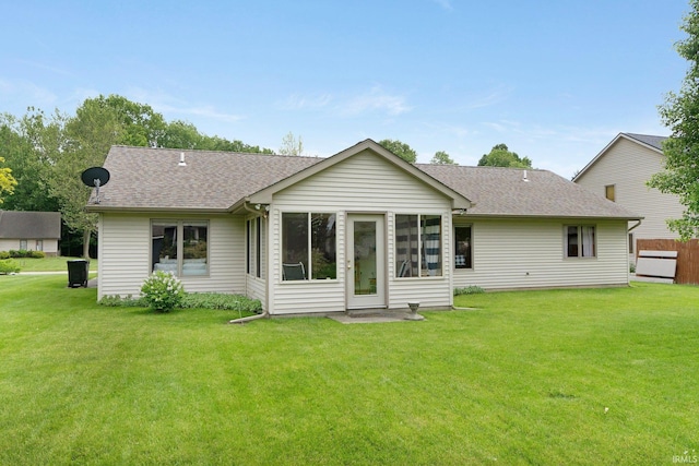 2104 Shady Ln, Garrett, IN 46738 - rear view of property featuring a yard, a shingled roof, and a sunroom