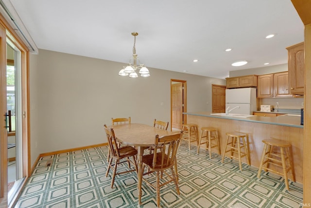 2104 Shady Ln, Garrett, IN 46738 - dining room with recessed lighting, a chandelier, baseboards, and light flooring