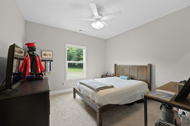 7018 S 350 St E, Lafayette, IN 47909 - bedroom with light carpet, a ceiling fan, and baseboards