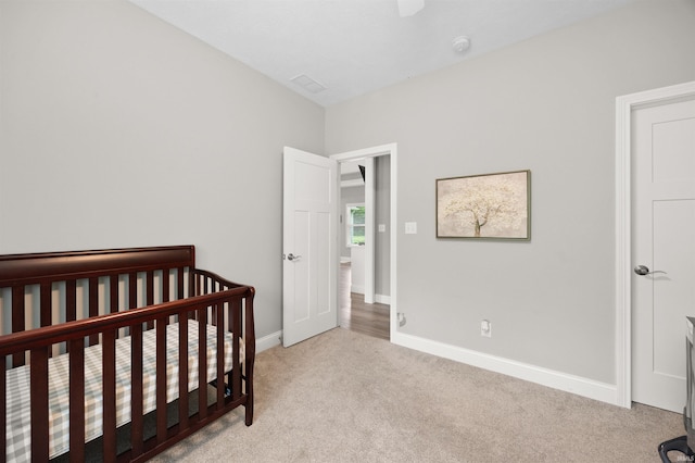 7018 S 350 St E, Lafayette, IN 47909 - carpeted bedroom with a crib and baseboards