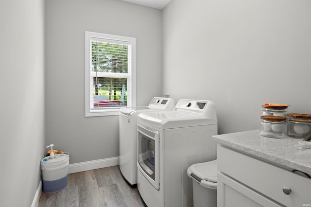7018 S 350 St E, Lafayette, IN 47909 - laundry area with independent washer and dryer, baseboards, and light wood-style flooring