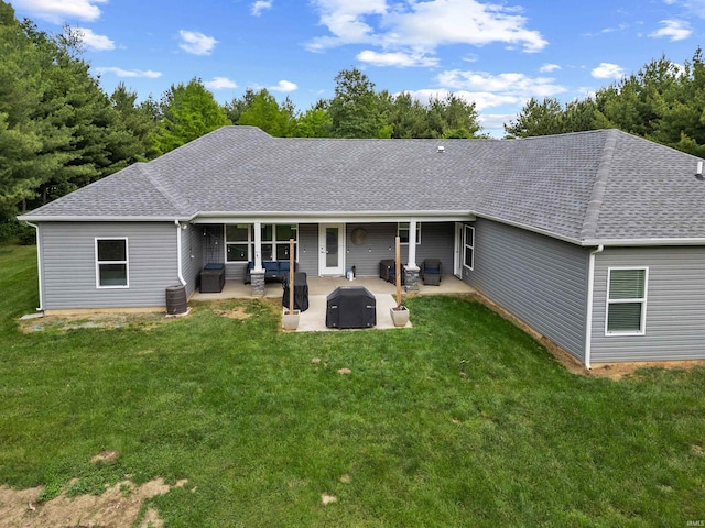 7018 S 350 St E, Lafayette, IN 47909 - back of property featuring a patio, a shingled roof, and a lawn